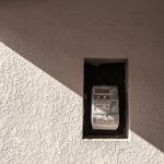a cell phone that is on the side of a building