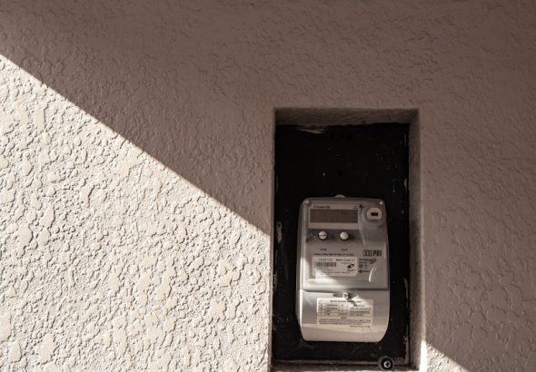 a cell phone that is on the side of a building